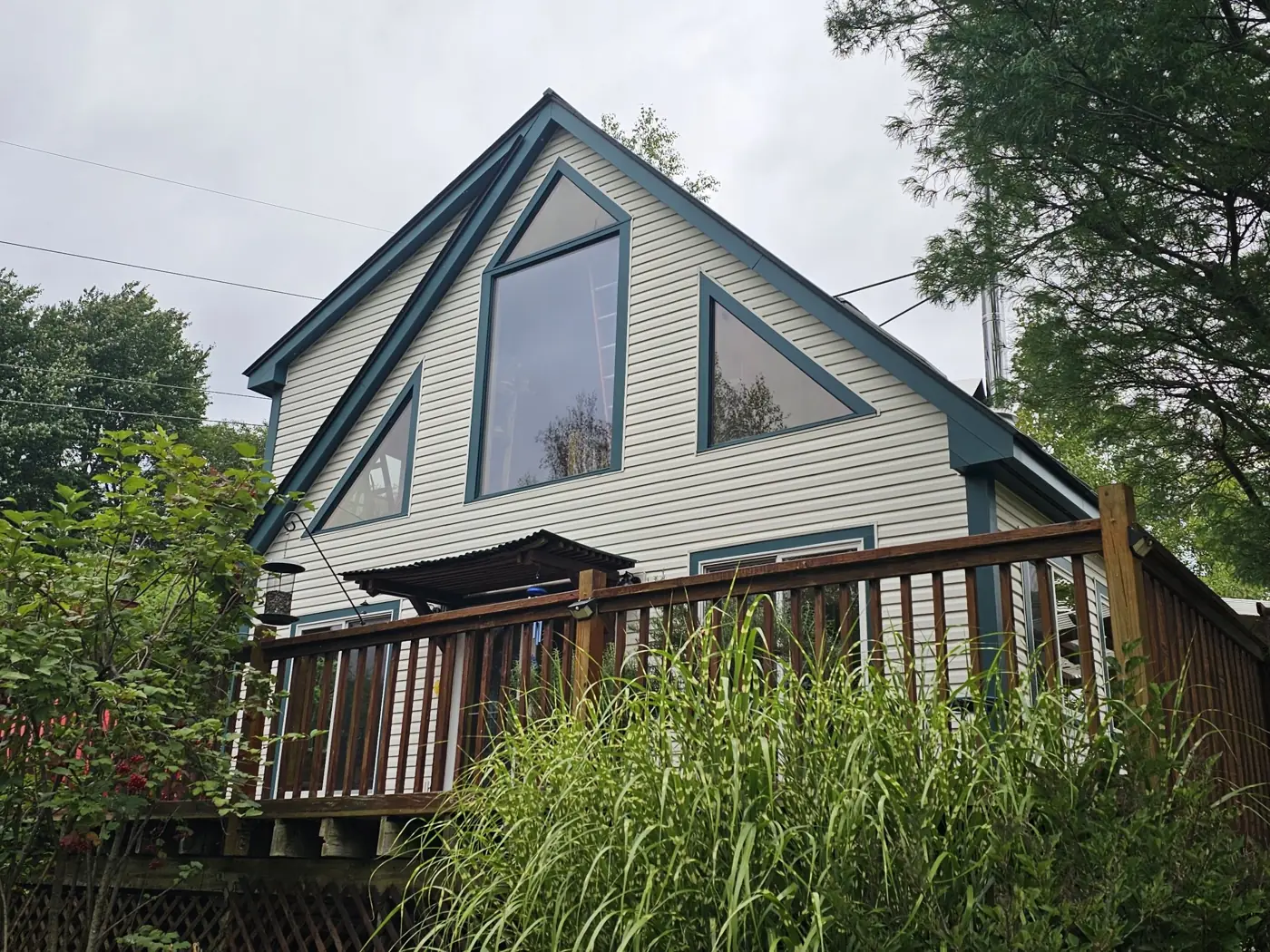 Gable end of a house with freshly painted fascia and window trim
