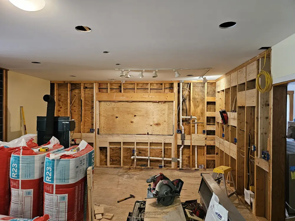 Kitchen walls stripped to the framing with new plumbing and wiring